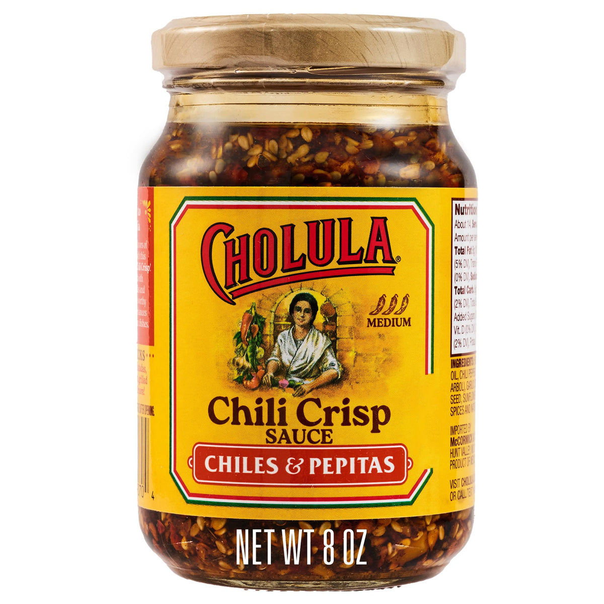 Cholula Chili Crisp texture close-up shows crunchy pepitas and seeds.