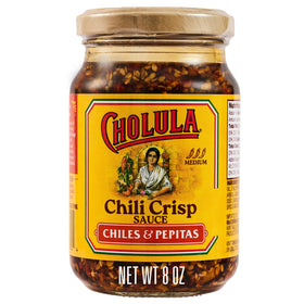 Cholula Chili Crisp texture close-up shows crunchy pepitas and seeds.