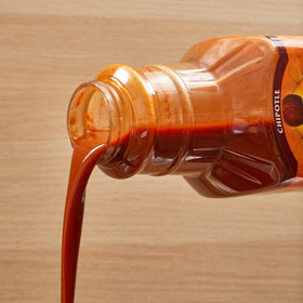 Bulk Cholula Chipotle 64 oz container stocked for steady service.
