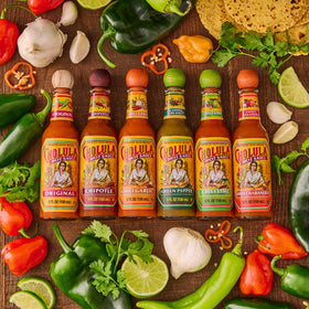 Cholula bottle on table with eggs breakfast setup and peppery aroma
