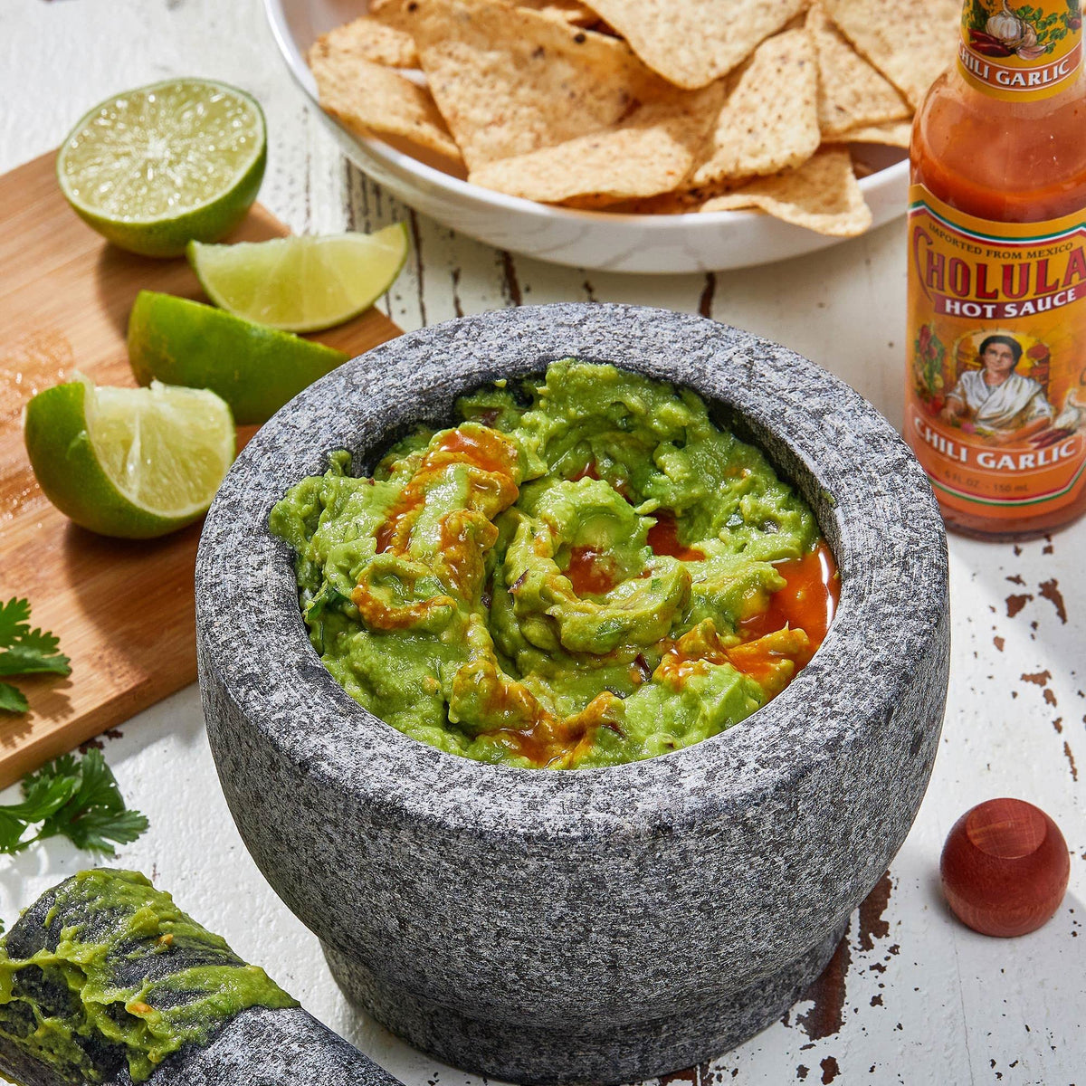 Cholula Hot Sauce Chili Garlic on tacos for enhanced heat.