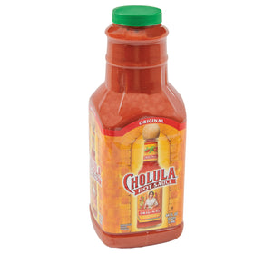 Cholula Original hot sauce bottle pouring onto tacos for balanced flavor