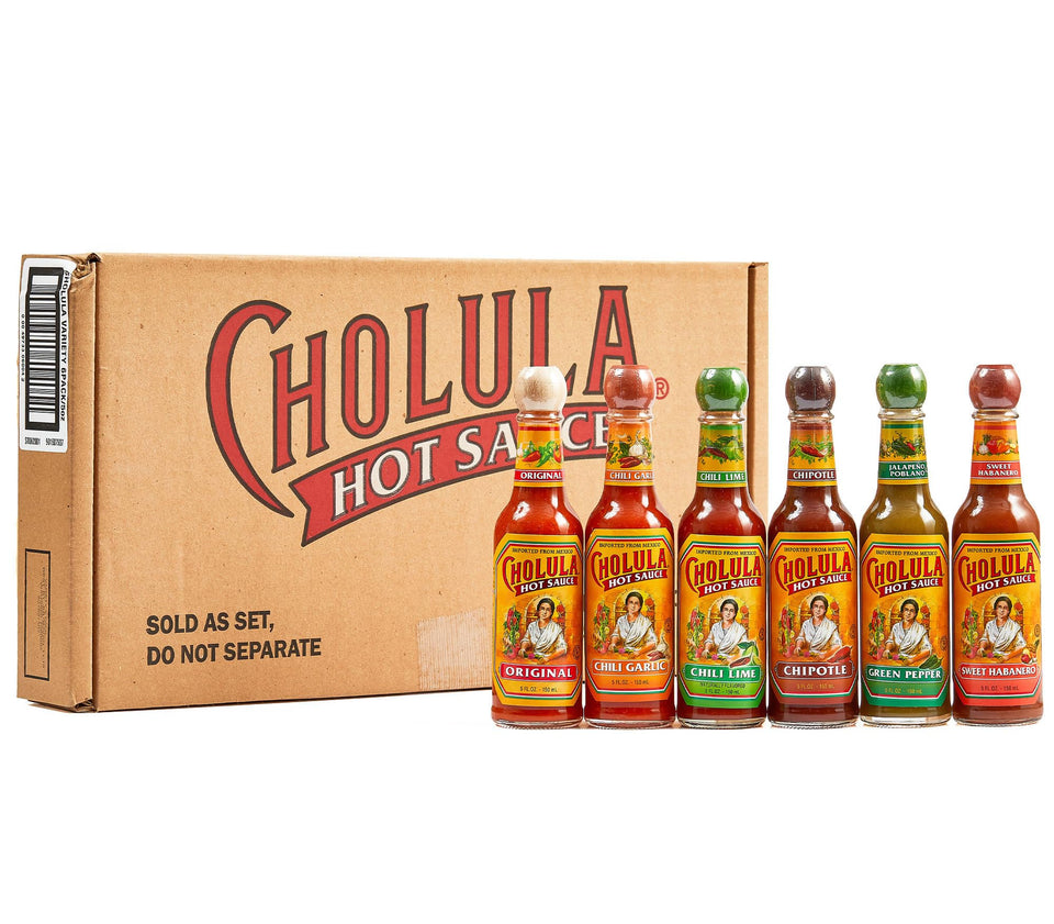 Cholula Original Hot Sauce bottle pours over eggs, highlighting balanced heat and rich flavor