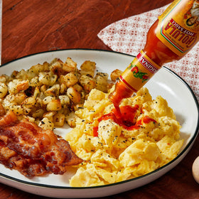 Cholula Original Hot Sauce on eggs adding subtle breakfast heat