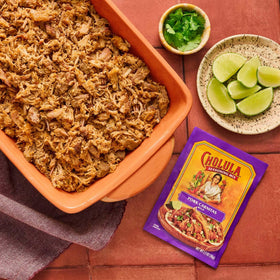 Cholula Pork Carnitas burrito bowl setup with seasoned pork and toppings
