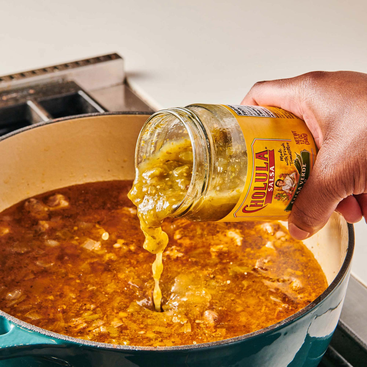 Cholula Salsa Verde six-pack on the kitchen counter.