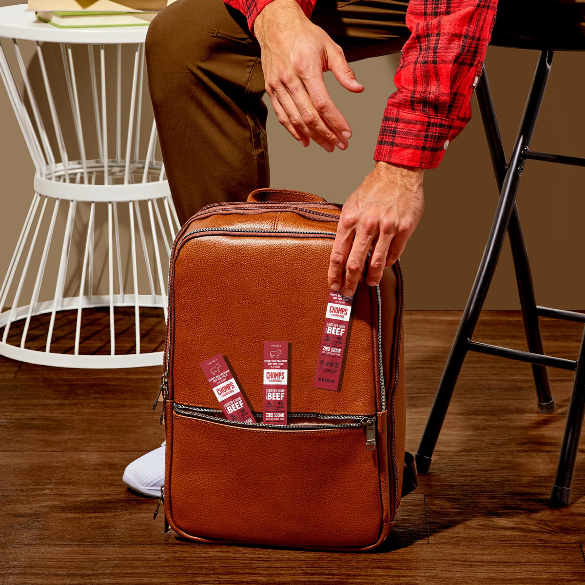Chomps smoky BBQ beef jerky stick serving idea for portable snacking on hikes or commutes.