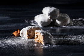 Close-up of Chrisanthidis Kourabie almond cookies, perfect for dessert platters