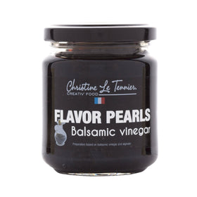 Christine Le Tennier balsamic pearls in a jar, ready to elevate salads with a burst of flavor.