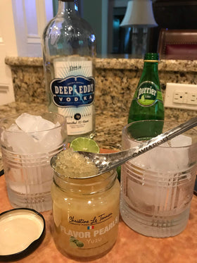 Christine Le Tennier Yuzu Pearls bottle pour showcases citrus flavor for drinks and dishes.
