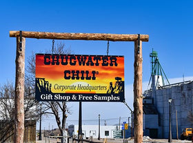 Chugwater Chili being sprinkled on burgers demonstrates versatile use.