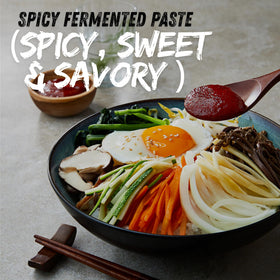Chung Jung One gochujang bibimbap bowl ready to serve with glaze.