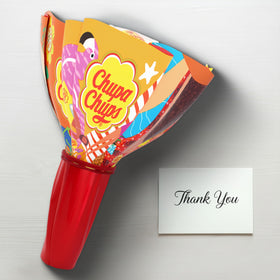 Chupa Chups sour green apple lollipop close-up, tart twist enjoyed