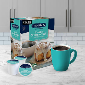 CINNABON cinnamon aroma fills a cozy kitchen setup.