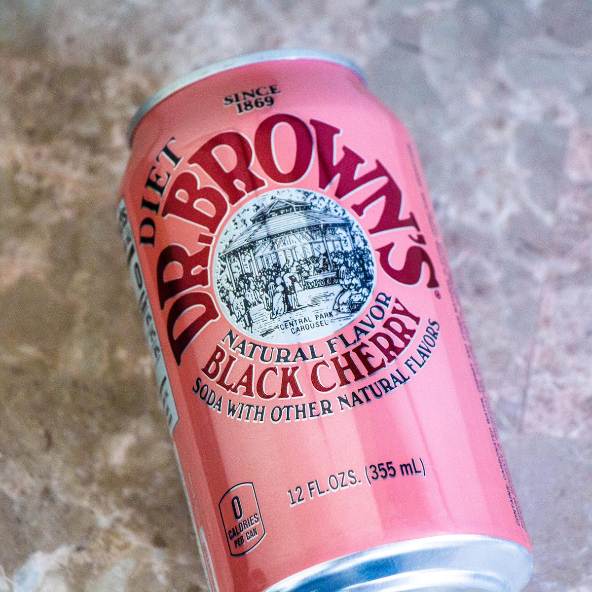 Circle of Drink Dr Brown's Diet Black Cherry Soda fizzing bubbles close-up highlights refreshing texture.