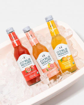 Citrus House Pink Grapefruit bottle with zesty aroma and bubbles.