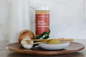 Closeup of the seasoning jar ready to boost ramen flavor.