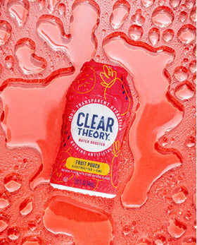 Clear Theory drops dissolving in water for easy flavor enhancement