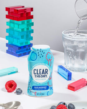Drops dissolving in water to create flavorful electrolytic hydration