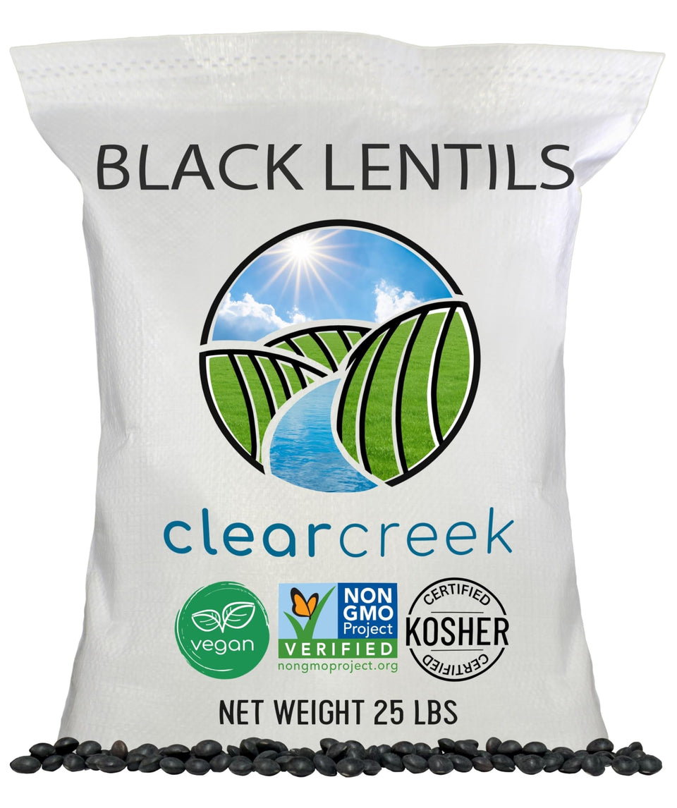 CLEAR CREEK Black Beluga lentils packaging shows brand and non-GMO verified status.