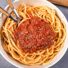 Club House Italiano seasoning sprinkled on pasta dish for easy flavor.