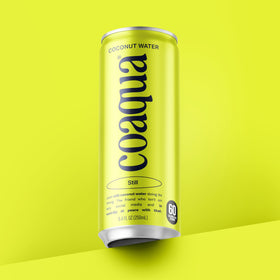 CoAqua vegan coconut water on kitchen counter, non-GMO.