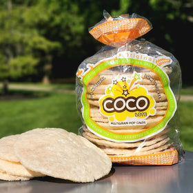 On-the-go COCO POP SNAX Coco Lite original rice cakes in a travel-friendly pack
