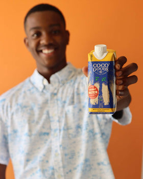 COCOGOODSCO pineapple-infused coconut water being poured for tropical twist
