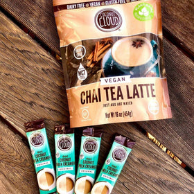 Pouring Coconut Cloud into hot coffee for a creamy, dairy-free texture.