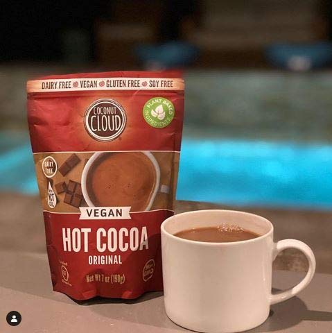 Coconut Cloud scooped cocoa powder ready to mix with water.