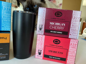 Coffee Beanery logo on Amaretto pod packaging, reflecting 1976 family-owned craft