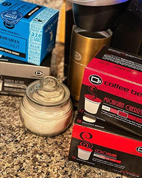 Coffee Beanery K-Cup machine brewing a cherry decaf cup