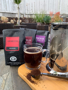 Coffee Beanery Michigan Cherry brewed cup with steam and inviting aroma