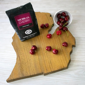 Coffee Beanery Michigan Cherry whole bean close-up revealing aromatic quality.