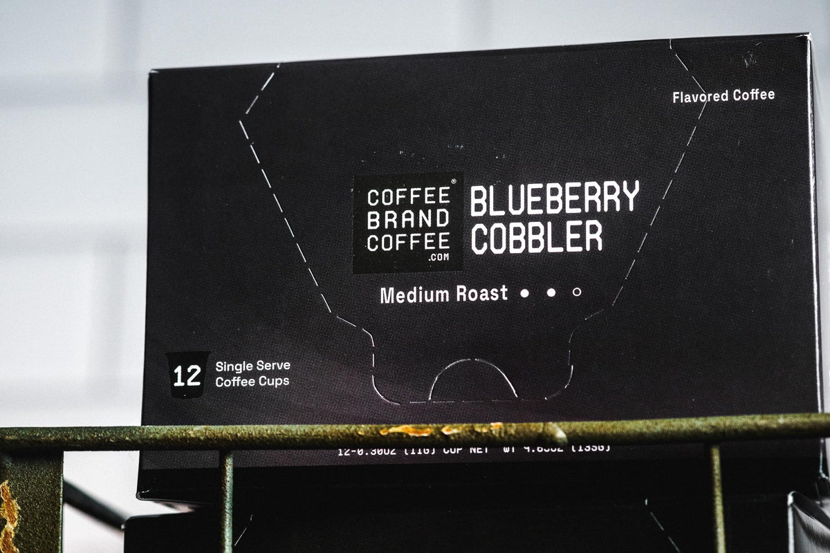 Coffee Brand Coffee Blueberry Cobbler K-Cups pack label detail with holiday-inspired design.