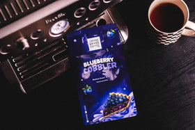Coffee Brand Coffee Blueberry Cobbler coffee bag highlighting premium flavor blend