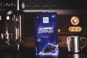 Coffee Brand Coffee Blueberry Cobbler pour steam implies rich, indulgent brew