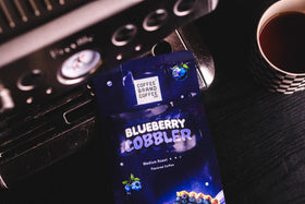 Coffee Brand Coffee Blueberry Cobbler steaming cup ready for a comforting sip