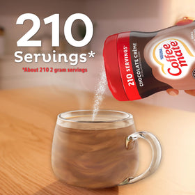 Coffee Mate chocolate creamer dissolving in coffee in a glass cup