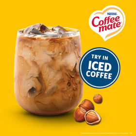 Hazelnut Coffee Mate creamer blends into coffee cup