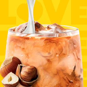 Coffee Mate Hazelnut liquid creamer enriches latte with warm nutty aroma