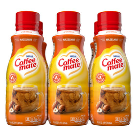 Coffee Mate Hazelnut liquid creamer poured into a cup for a creamy coffee