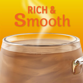 Coffee-mate Hazelnut powder creamer canister shown with measuring spoon for precise flavor