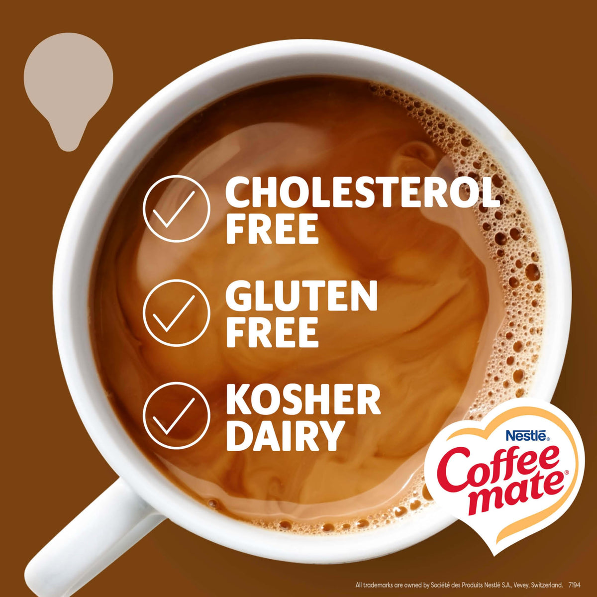 Coffee Mate Snickers creamer being poured into a mug for a rich treat.