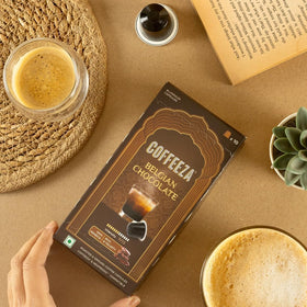 Close look at Coffeeza aluminum capsules signaling durable packaging and freshness protection.