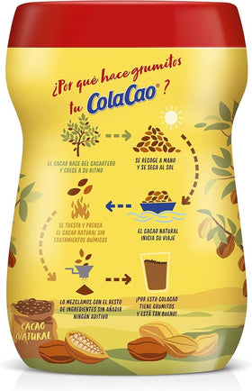 Cola Cao chocolate powder being scooped for mixing.