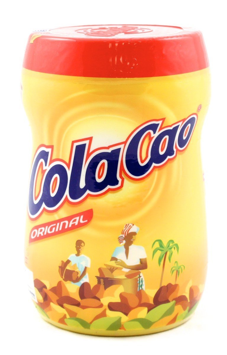Cola Cao original chocolate drink jar beside a glass of milk for a cozy cup