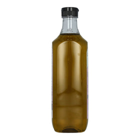 Colavita Roasted Garlic EVOO being poured to finish dishes with aromatic garlic.
