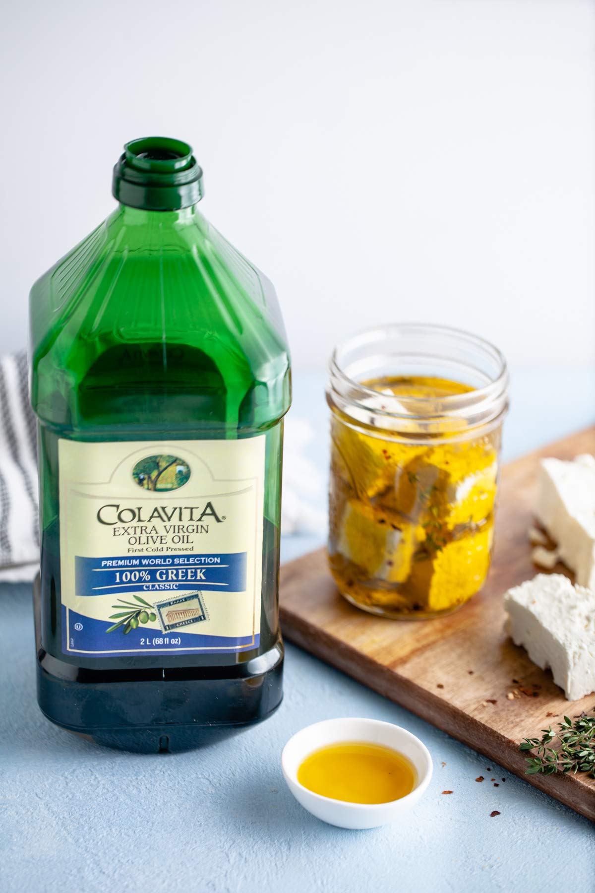 Colavita smooth-fruity olive oil pour highlights its versatile flavor for marinades.