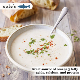 Close-up of creamy texture in Cole's soup for rich flavor potential.